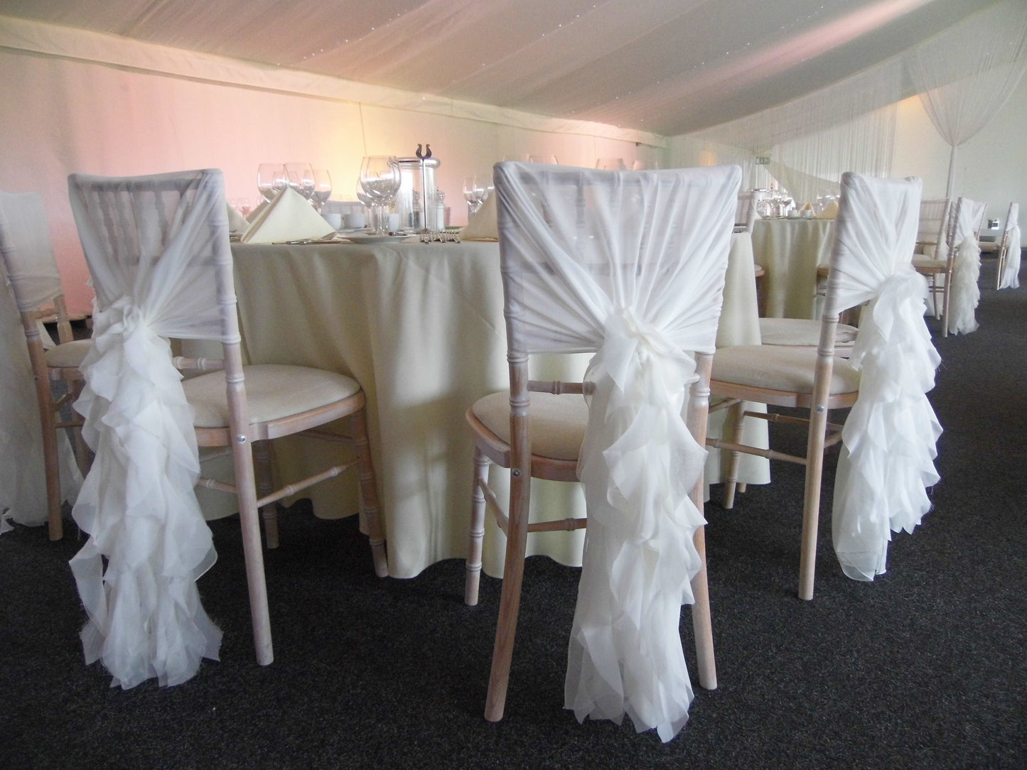White chiffon hood with curly ruffle hire
